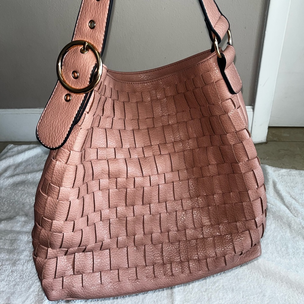 This hobo bag is “Blush” or a light mauve. The pictures don’t do it justice.